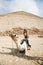 Woman camel and pyramid