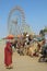 Woman camels and ferris wheels at Pushkar camel fair