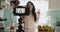 Woman, camera and live streaming in kitchen, food blog and tutorial or teaching at home. Female influencer, webinar and