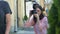Woman with camera taking photo of famous actors couple street, spying paparazzi
