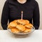 a woman and a candle on a hamburger cake. original cake.