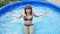 Woman is by a canicular day in a pool