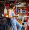 Woman car mechanic in the garage