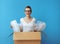 Woman in cardboard box with air bubble film packaging material