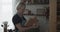 Woman carpenter examines wooden blank for a cutting board