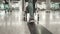 Woman carry luggage cart walk at airport terminal