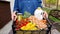 Woman carrying box with groceries after home delivery