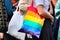 Woman carrying cloth bag in rainbow colors