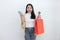 Woman Carrying Red Shopping Bag, Credit Card, Mobilephone with Happy Face