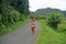 WOMAN CARRYING WOOD IN INDONESIA