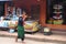 Woman is carrying a yoke at Luang Prabang City Loa