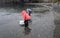 Woman catching Caplin fish with a net