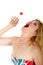 Woman Catching Cherry Tomato In Mouth