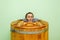 Woman in cedar spa barrel body rejuvenation and relax sauna