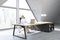 Woman in a CEO office with triangular window