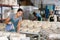 Woman ceramist working in pottery workshop