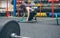 Woman changing the discs of the weightlifting bar