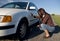 Woman changing tyre.