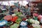 A woman charges a customer at her vegetable stall at the Ba Le market in Hoi An