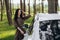 Woman is charging rental electric car in futyre