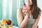 Woman cheating during diet and eating doughnut. selective focus on mouth