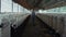 Woman checking cattle shed at countryside rear view. Dairy production farm.