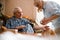 Woman checking husband`s blood pressure