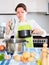 Woman checking pan with spoiled food