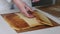 A woman checks a freshly baked biscuit. Cooking biscuit cake Dairy girl. Close-up