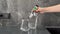 A woman checks the quality of tap water in a jug