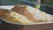 Woman Chef Baking Apple Strudel. Female Hands Applying Egg Wash onto Dough with Basting Brush