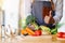 A woman chef holding and making thumb up to show good sign to a green broccoli with vegetables tray