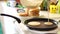 Woman chef pouring pancake batter on a frying pan