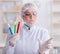 Woman chemist pressing virtual button in lab