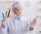 Woman chemist pressing virtual button in lab