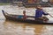 Woman and child in boat, Tonle Sap, Cambodia
