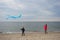 Woman and child having fun with a kite