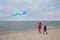 Woman and child having fun with a kite