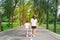 Woman and child walking on footpath and walkway in the public park and feeling happiness and enjoy.