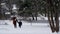 Woman and Child Walking in the Snow