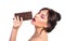 Woman and chocolate. Beautiful young woman is eating chocolate o