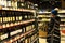 Woman choises Store of alcoholic drinks