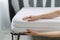 Woman choose new orthopedic mattress in furniture store, closeup