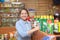 Woman chooses agricultural chemicals in the store