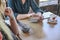 Woman chooses a dish on a tablet in a restaurant. Digital menu. orders food