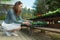 Woman chooses flower pots at garden plant nursery store