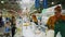 Woman chooses fresh cheeses at display in farmers market