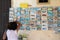 Woman chooses postcards in Otranto, Salento, Puglia, Italy