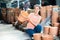 Woman chooses pots clay pots in store warehouse