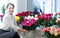 Woman chooses roses at flower store